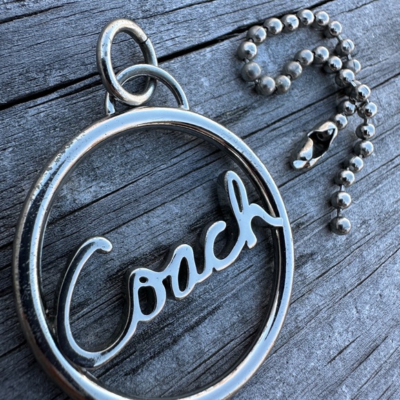 Coach Circular Silver Keychain
Coach Silver Circle Keychain – Timeless Elegance - Picture 3 of 16